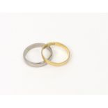 A 22ct yellow gold wedding band, London 1899, size P, and an 18ct white gold wedding band,
