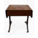 An early 19th century rosewood combined sofa and games table,