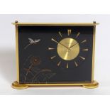 Jaeger - Le Coultre: A Swiss perspex 'Marina' mantel clock, decorated with flowers and a dragonfly,