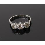 A three stone brilliant cut diamond ring, circa 1959, diamonds weight approx 0.25, 0.50 and 0.