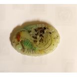 A Chinese jade pendant, 20th century, of oval form,