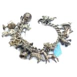 A silver curb link 'charm' bracelet, London 1966, hung with various charms including; a football,