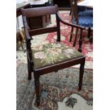 A George III mahogany ebony strung open arm elbow chair, with bar back, drop in needlework seat,