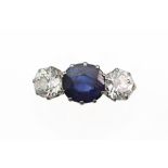 An early 20th century gold, sapphire and diamond three stone ring,