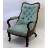 An early Victorian rosewood frame armchair, with shaped curved button down upholstered back,