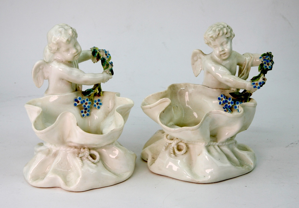 A pair of Moore Brothers porcelain posy baskets, retailed by Thomas Goode & Co London,