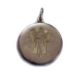 An early 20th century 9ct rose gold round locket, engraved with a monogram, Birmingham 1915, 25.