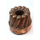 A good 19th century French circular copper jelly mould by Trottier,