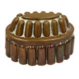A 19th century copper oval shaped jelly mould no, R H 302, with two rows of finger shaped fluted,