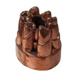 A Victorian copper oval tiered jelly mould, no. N 101.