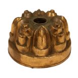 A copper circular shaped jelly mould, with arched and moulded circular panels,