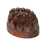 A Victorian oval copper jelly mould, formed as two tiers of leaves, unmarked, 12cm high, 17.