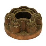 A Victorian copper circular shaped border jelly mould, with six rounded loop linked columns,