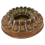 A Victorian copper circular pedestal border jelly mould, with ring of lobed panels,