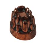 A Victorian small oval copper jelly mould by Benham & Froud, no.