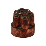 A Victorian copper circular tiered jelly mould by Benham & Froud, no.