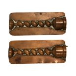 A pair of 19th century copper chocolate or sugar moulds as half spiral columns,