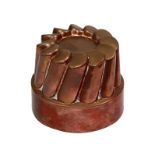 A Victorian copper circular shaped jelly mould, by Benham & Froud, no.