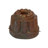 A Victorian copper circular tiered jelly mould, raised beaded top, over reeded sides,