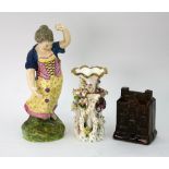 A cream glazed earthenware figure, circa