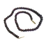 A garnet bead single row necklace, the o