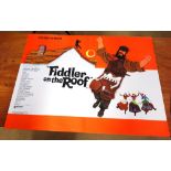 Film posters; a group of three comprising; 'Fiddler on the Roof' and two 'Oliver',