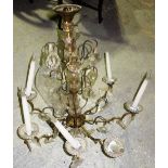 An early 20th century glass and brass eight branch chandelier.