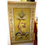 An early 20th century large framed tapestry depicting a deer and a tree.