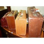 Three 20th century leather suitcases and a doctor's case.