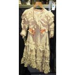 Clothing; a group of three 19th/20th century lady's two piece ensembles,