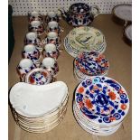A Victorian Imari decorated part tea set and ten Limoges gilt border crescent shaped plates and a