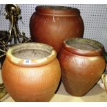 Three terracotta plant pots, (3).