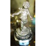 A 19th century cast metal figure of a cherub on a turned marble base.