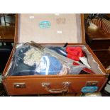 Clothing; a quantity of miscellaneous clothing and accessories contained in a brown leather case.