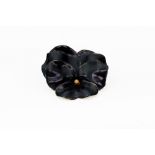 An early 20th century gold and black enamel flower brooch/pendant by Tiffany & Co,