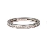 A modern 18ct white gold and diamond eternity ring,