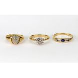 Three gold and gem set rings,