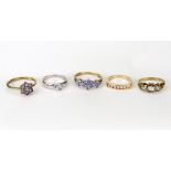 Five gold and gem set rings,