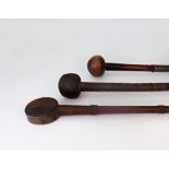 Three Tribal sticks or clubs, two mounted with wire bands, one bound in wire,
