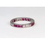 A modern ruby and diamond eternity ring,