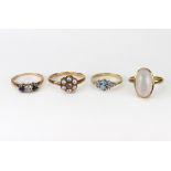 Four rings, comprising; a modern 18ct gold, oval aquamarine and round brilliant diamond dress ring,