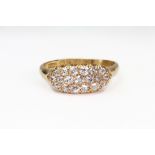 A Victorian 18ct gold and diamond oval cluster ring, pave set with 19 old-cut diamonds approx. 0.