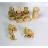 A set of six Indian ivory napkin rings, early 20th century, carved with elephants,