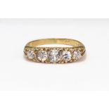 A modern 18ct gold and diamond five stone carved half-hoop ring in Victorian style,