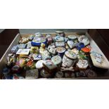 A large collection of 20th century and later enamel and porcelain trinket boxes, approx 70.