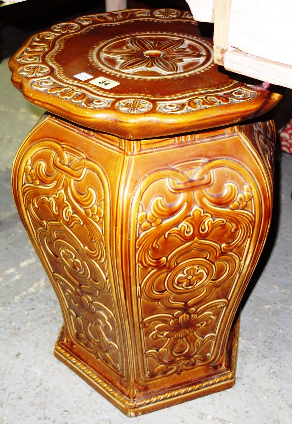 A Victorian brown glazed jardiniere, of bulbous hexagonal form, 52cm high.