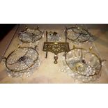 A group of four gilt metal and glass bag chandeliers and a brass trivet, (5).