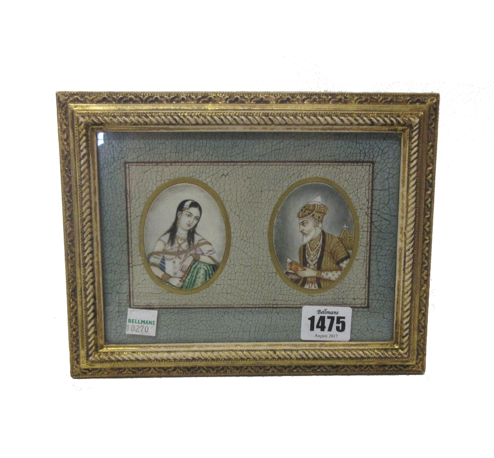 A pair of Persian oval miniature portraits of a man and woman, each 6.5cm x 5cm, in common frame.