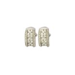 A pair of white gold and diamond set earclips by Picchiotti, each of curved rectangular form,