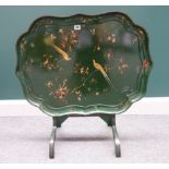 A 19th century green painted shaped rectangular papier mache tray, on later folding stand,